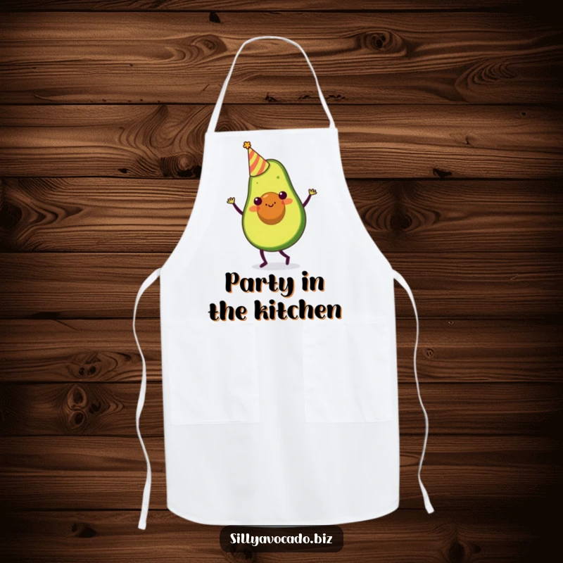 Funny apron showcasing an avocado character in a tiny party hat, doing a silly dance while cooking with humor.