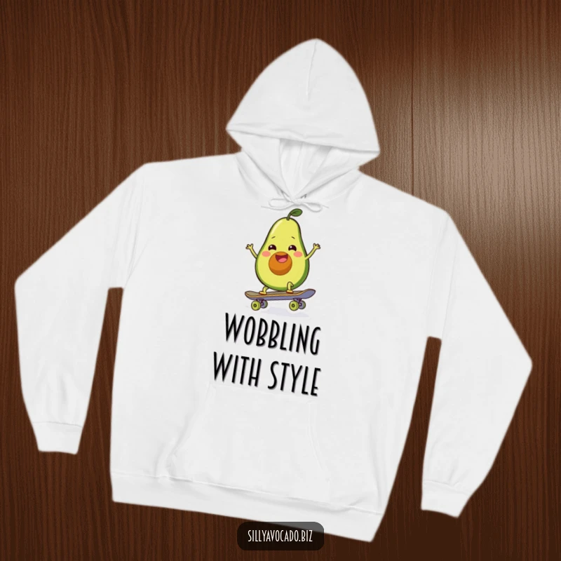 Funny hoodie featuring a grinning, wiggly avocado confidently attempting to ride a skateboard down the street.